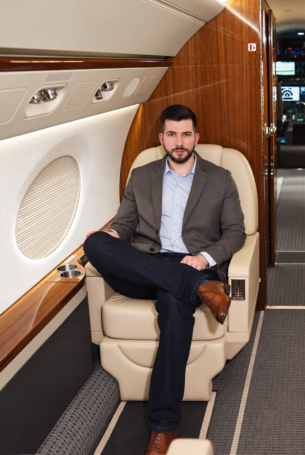 Joshua Bauder, seated in a private jet cabin